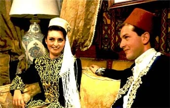 Femme et homme algéries portant un tarbouche
